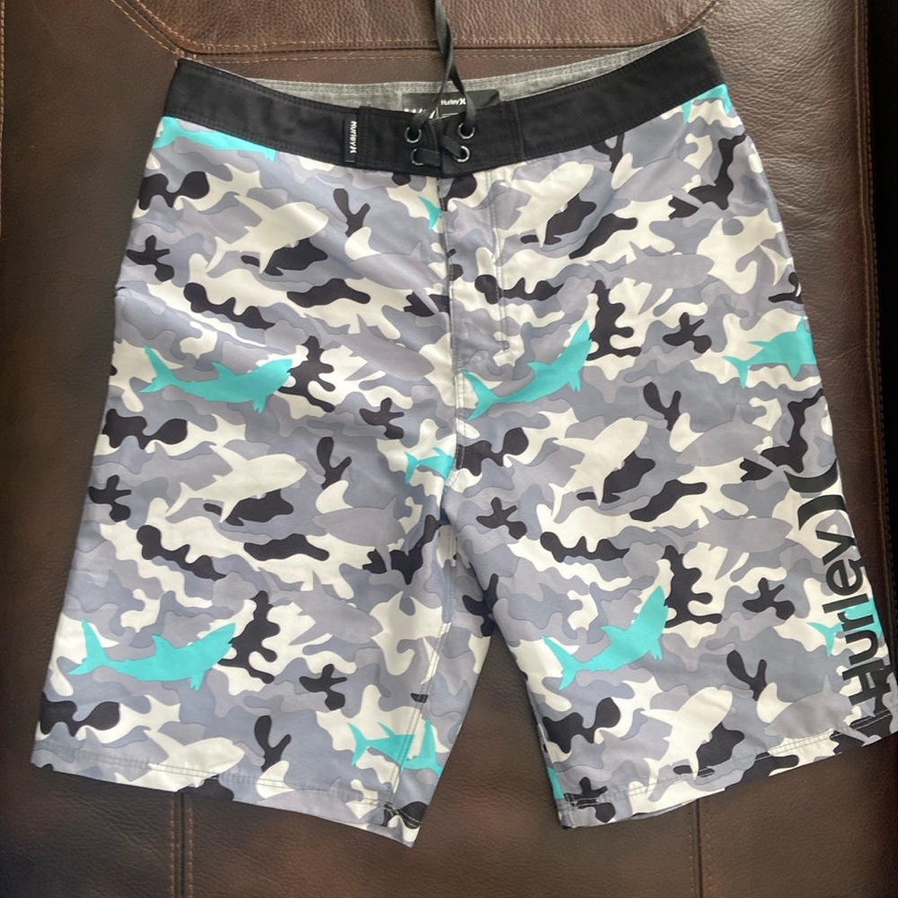 Sale 2/$10* Boys Hurley swim trunks w/shark/camo pattern. Size 14 (27" waist)